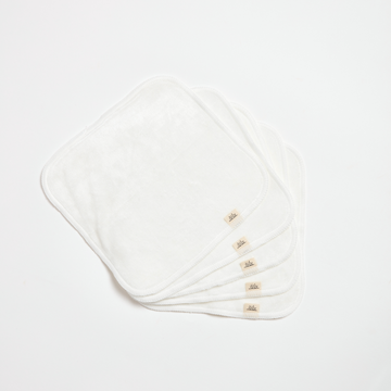 Set of white cloths with brand logo on a light gray background