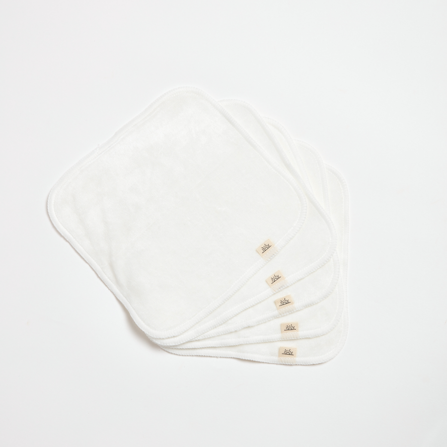 Set of white cloths with brand logo on a light gray background