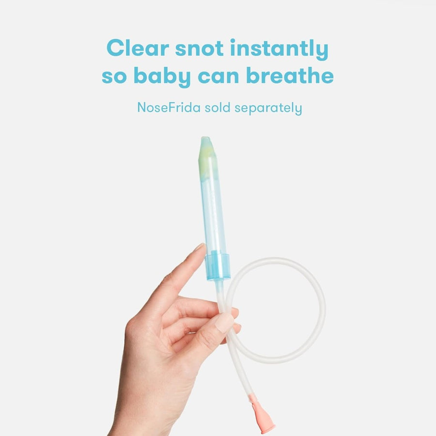Image of a hand with a light skin tone holding a NoseFrida Nasal Aspirator, against a cream background. Superimposed text reads, 