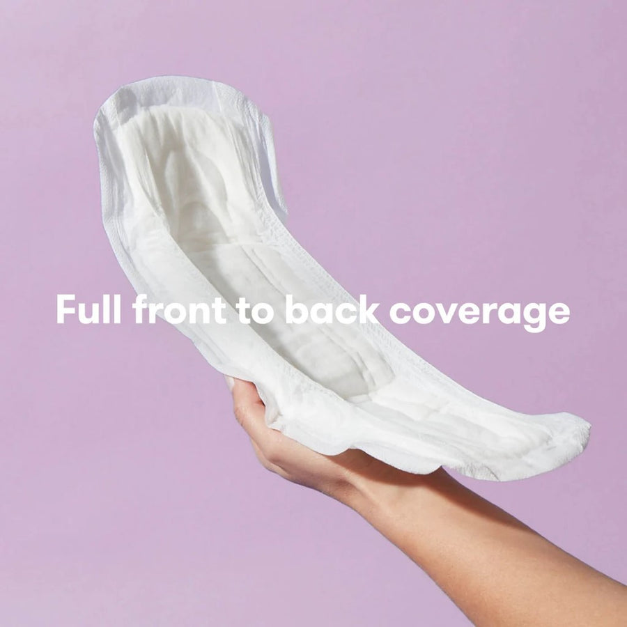 Image of an arm and hand holding a Frida Postpartum Catch-All Pad against a light pink background, with the text 