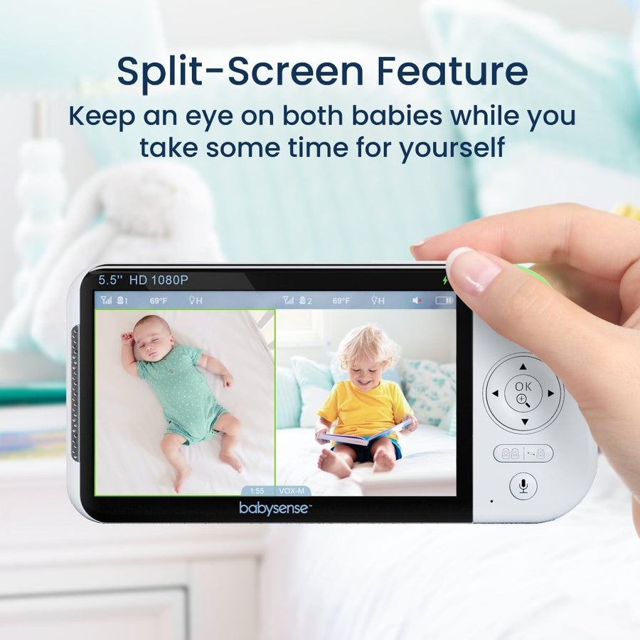 Picture of a person's right hand holding the monitor display, which shows a baby in a blue onesie sleeping on the left half of the screen, and a blonde toddler in a yellow t shirt sitting on a bed reading on the right half of the screen. Text at the top reads, 