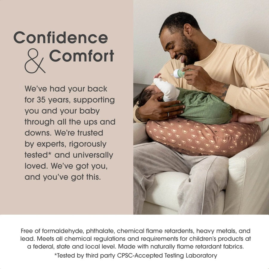 Man holding a baby with text about product trustworthiness and safety.