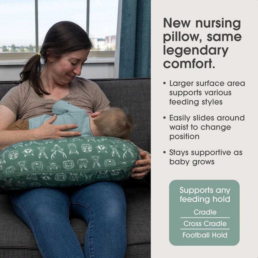 Woman using a green nursing pillow with text about its features