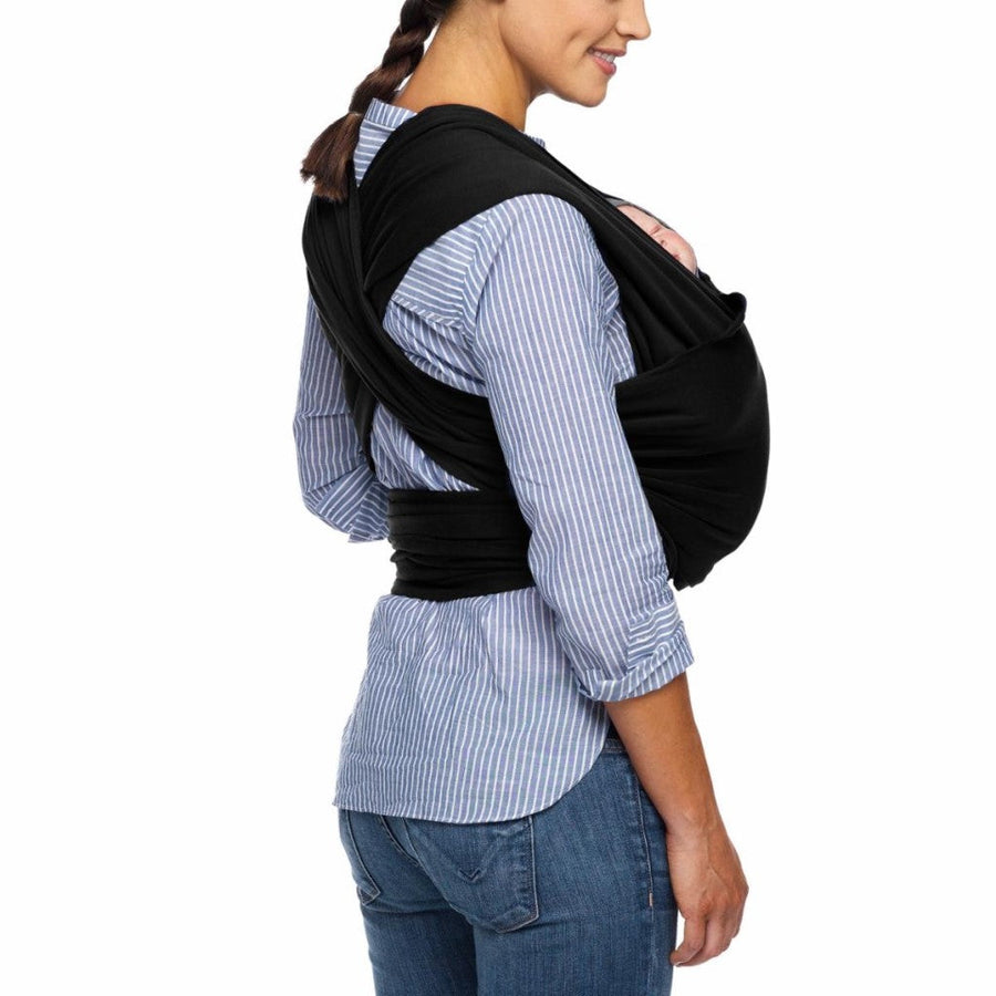 Picture of a side view of woman wearing black Moby Evolution baby wrap with infant