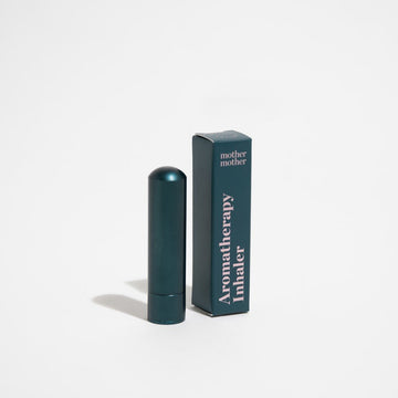 Blue aluminum Mother Mother aromatherapy inhaler tube shown with blue box with gold lettering